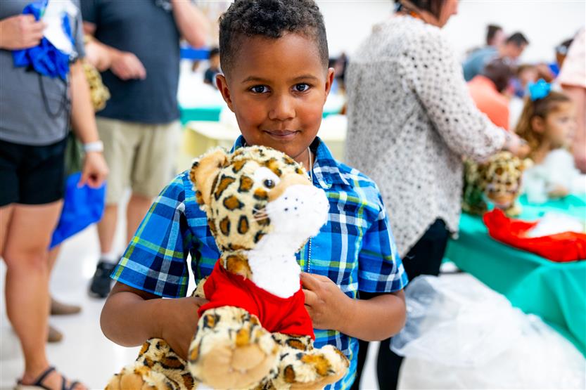 Students build a cheetah at a community event